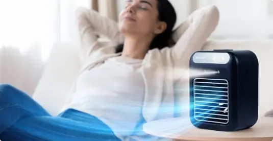 Woman enjoying cool airflow from Glacier Breeze – perfect for outdoor use